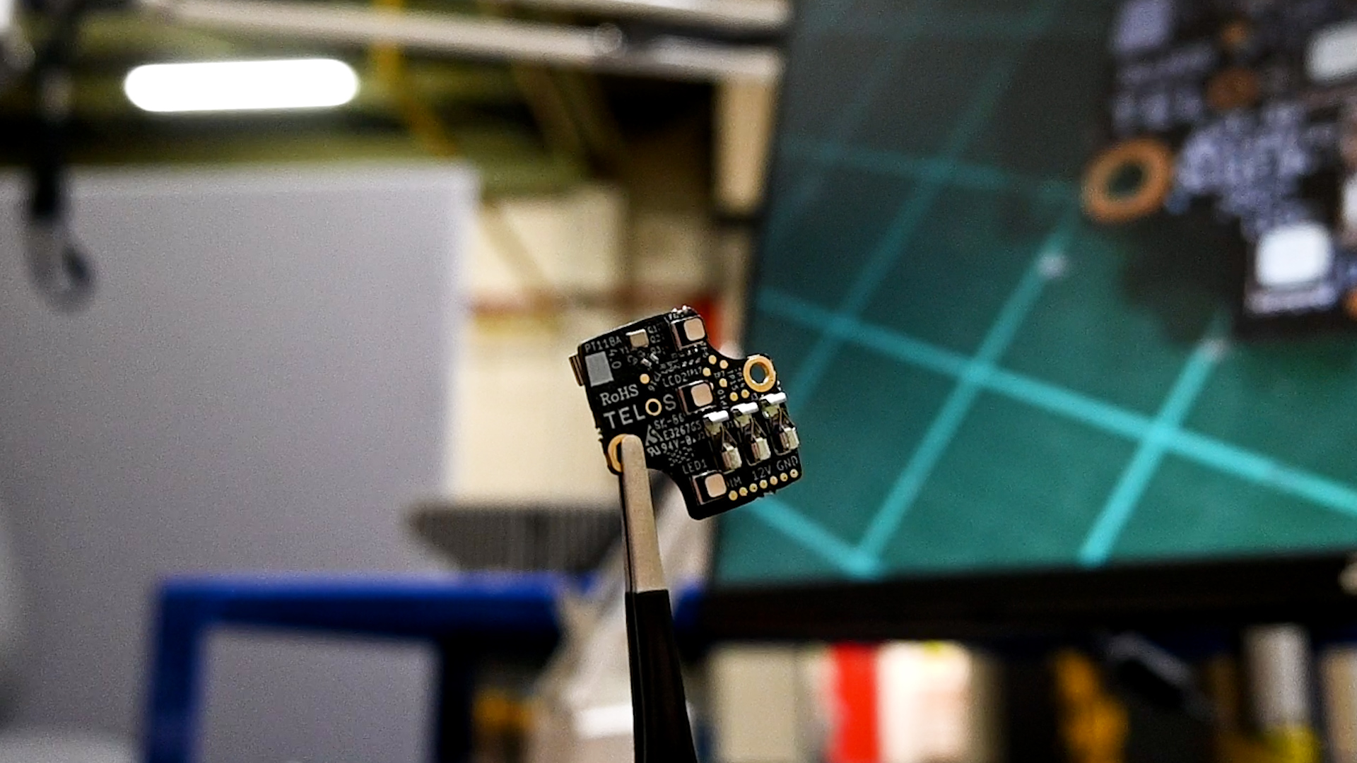 Telos mesh circuit board in tweezers